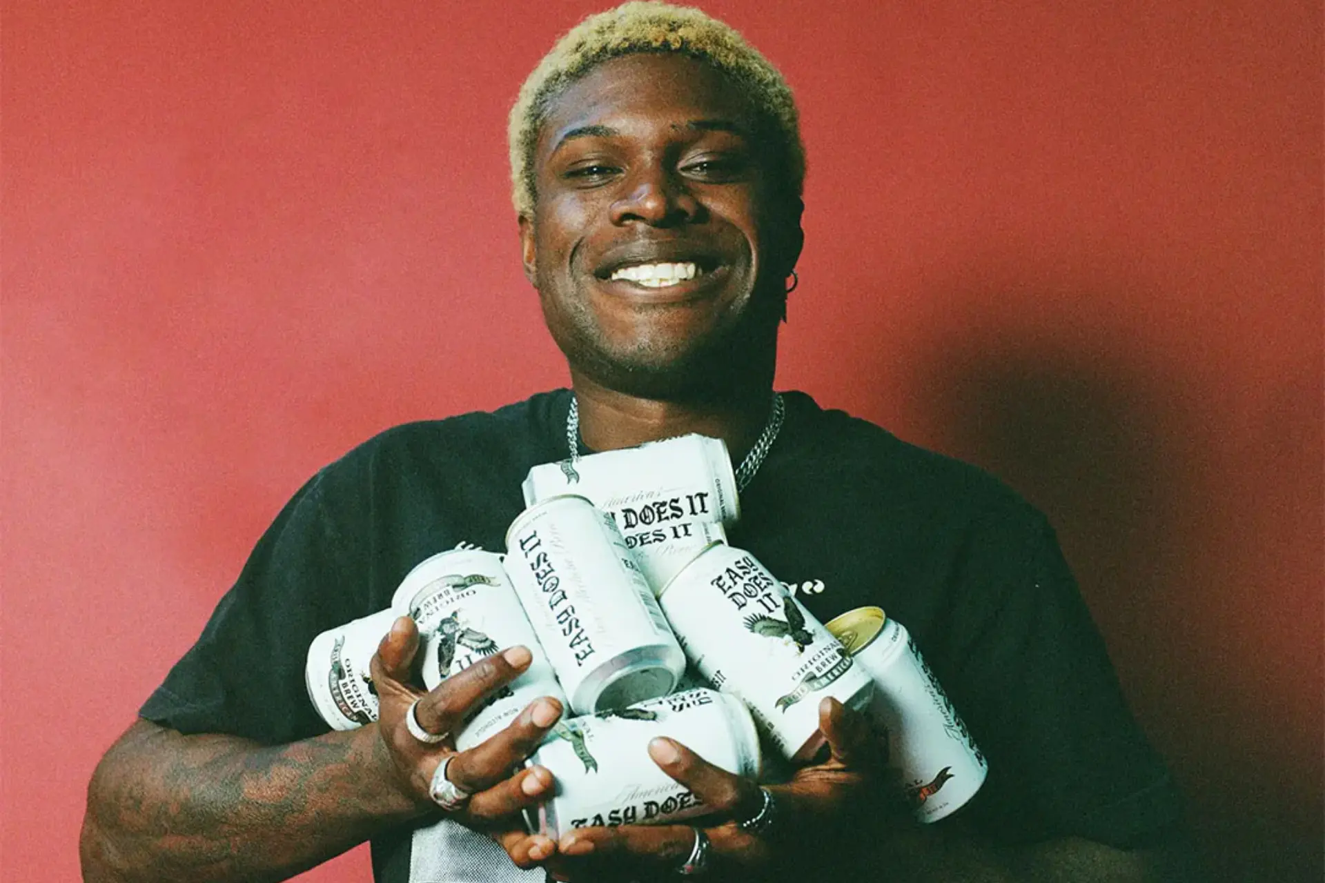 Person holding Easy Does It cans