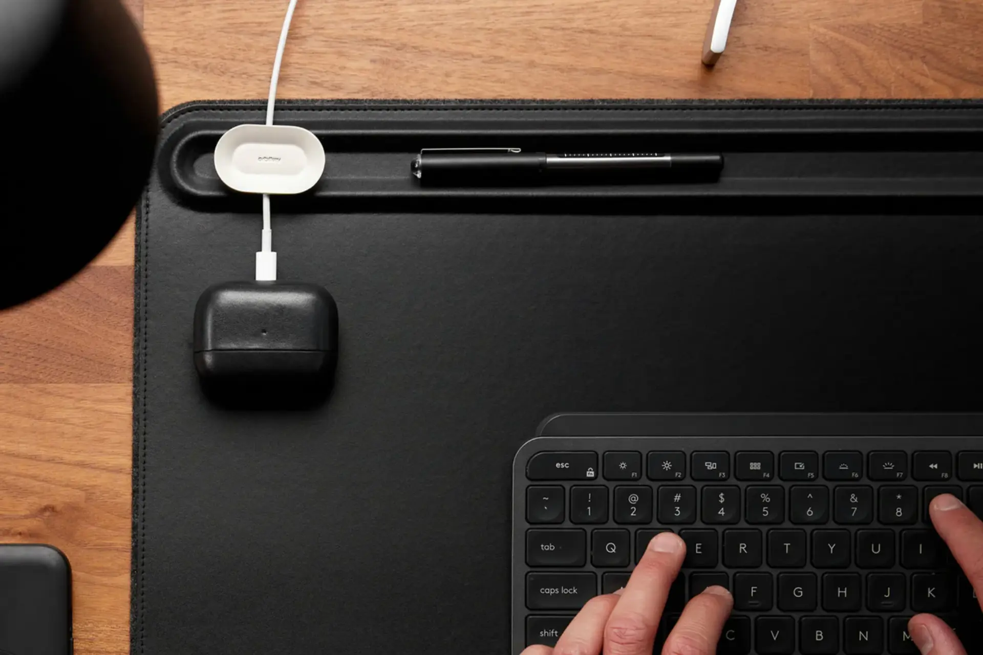 Orbitkey Desk Mat in use on a wood desk