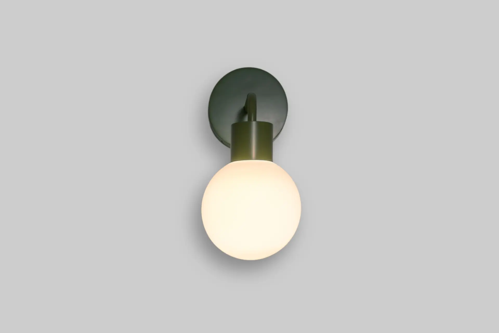 Poplight rechargeable wall sconce mounted in a bedroom