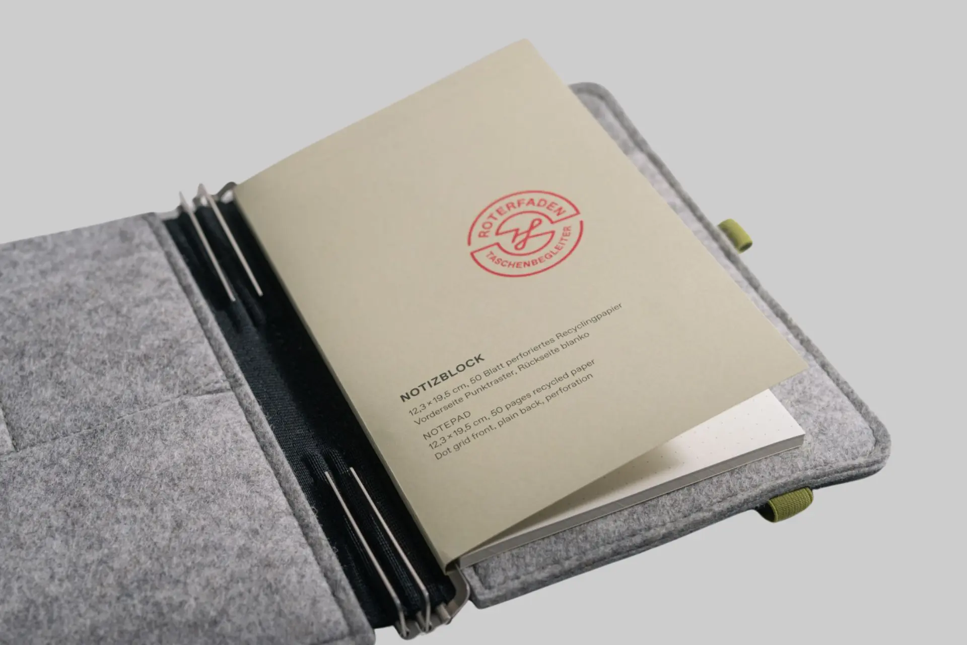 A Roterfaden HS6 Notepad open to a dot grid page, showcasing the recycled paper texture and perforation.